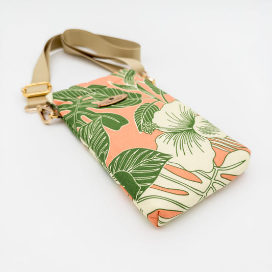 Floral patterned pouch with strap on a white background